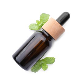 Photo of Bottle of essential oil and mint isolated on white, top view