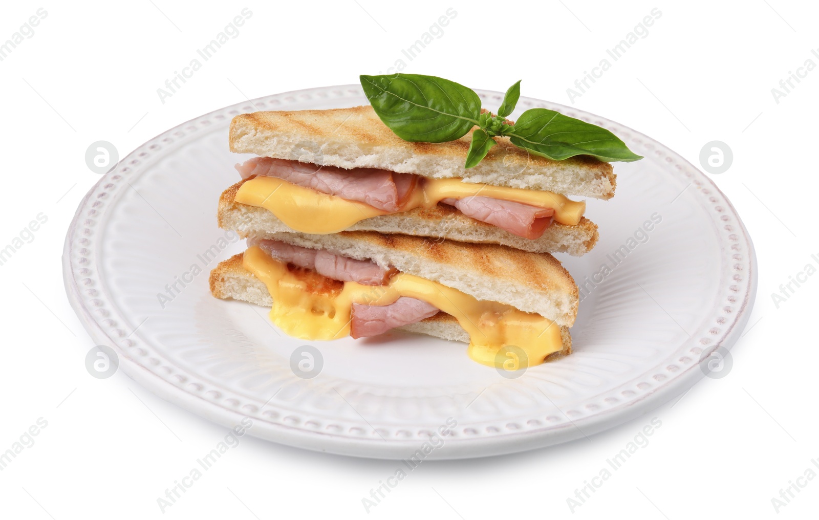 Photo of Pieces of toasted bread with melted cheese, ham and basil isolated on white