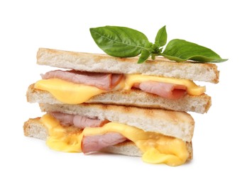 Photo of Pieces of toasted bread with melted cheese, ham and basil isolated on white