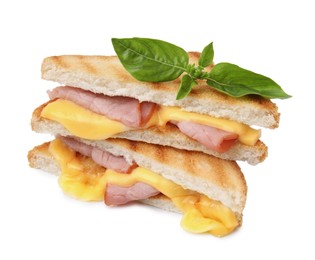 Photo of Pieces of toasted bread with melted cheese, ham and basil isolated on white