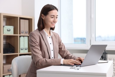 Woman with good posture working in office