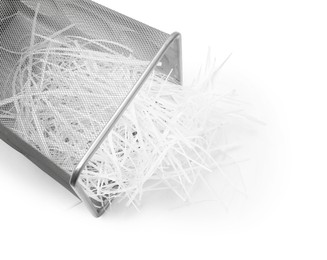 Metal basket and shredded paper isolated on white, above view