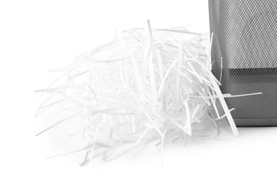 Photo of Shredded paper and metal basket isolated on white