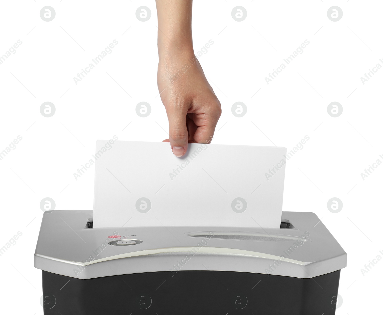 Photo of Woman destroying paper with shredder on white background, closeup