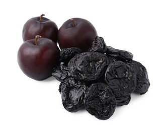 Delicious prunes and fresh ripe plums isolated on white