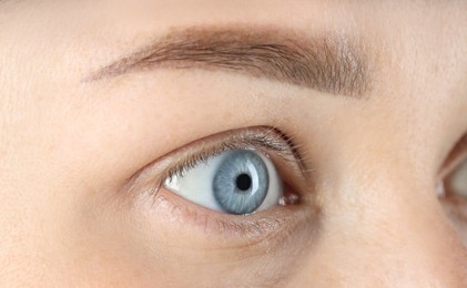 Photo of Woman with beautiful blue eyes, macro photo