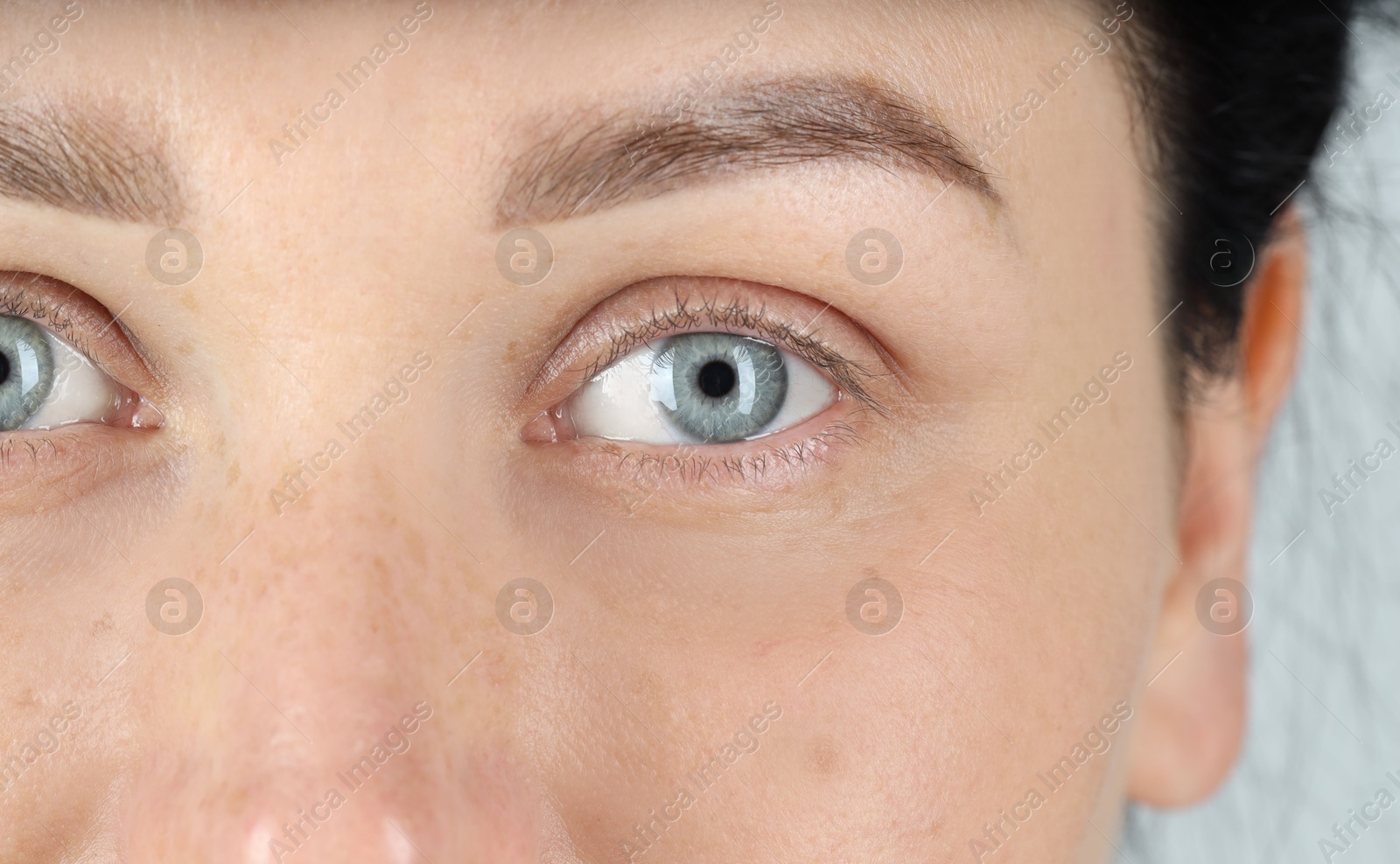 Photo of Woman with beautiful blue eyes, closeup view