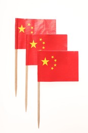 Small paper flags of China isolated on white