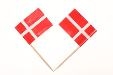 Small paper flags of Denmark isolated on white