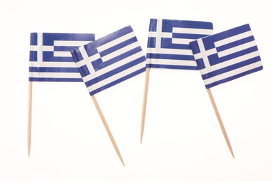 Small paper flags of Greece isolated on white