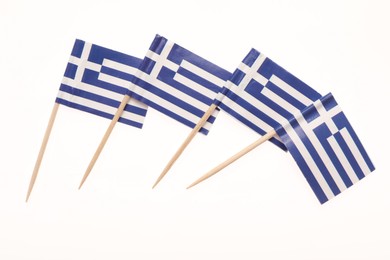 Small paper flags of Greece isolated on white