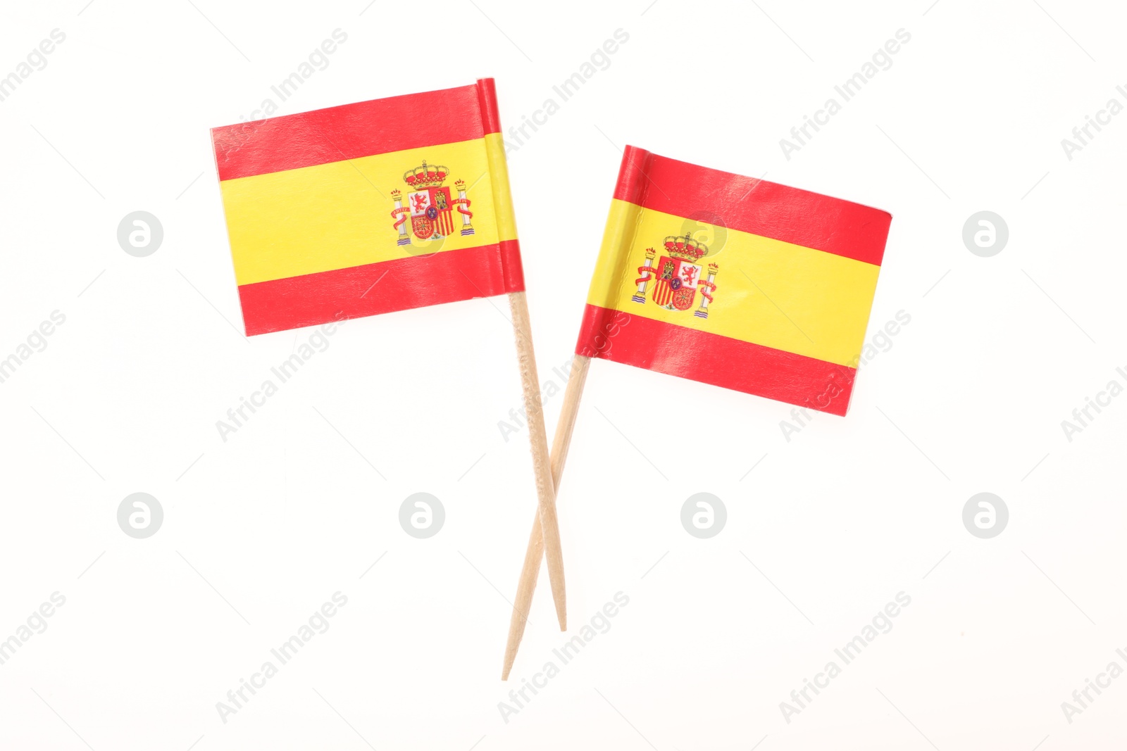 Photo of Small paper flags of Spain isolated on white