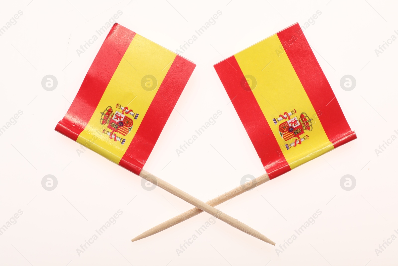 Photo of Small paper flags of Spain isolated on white