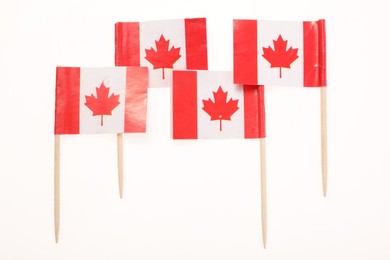 Photo of Small paper flags of Canada isolated on white