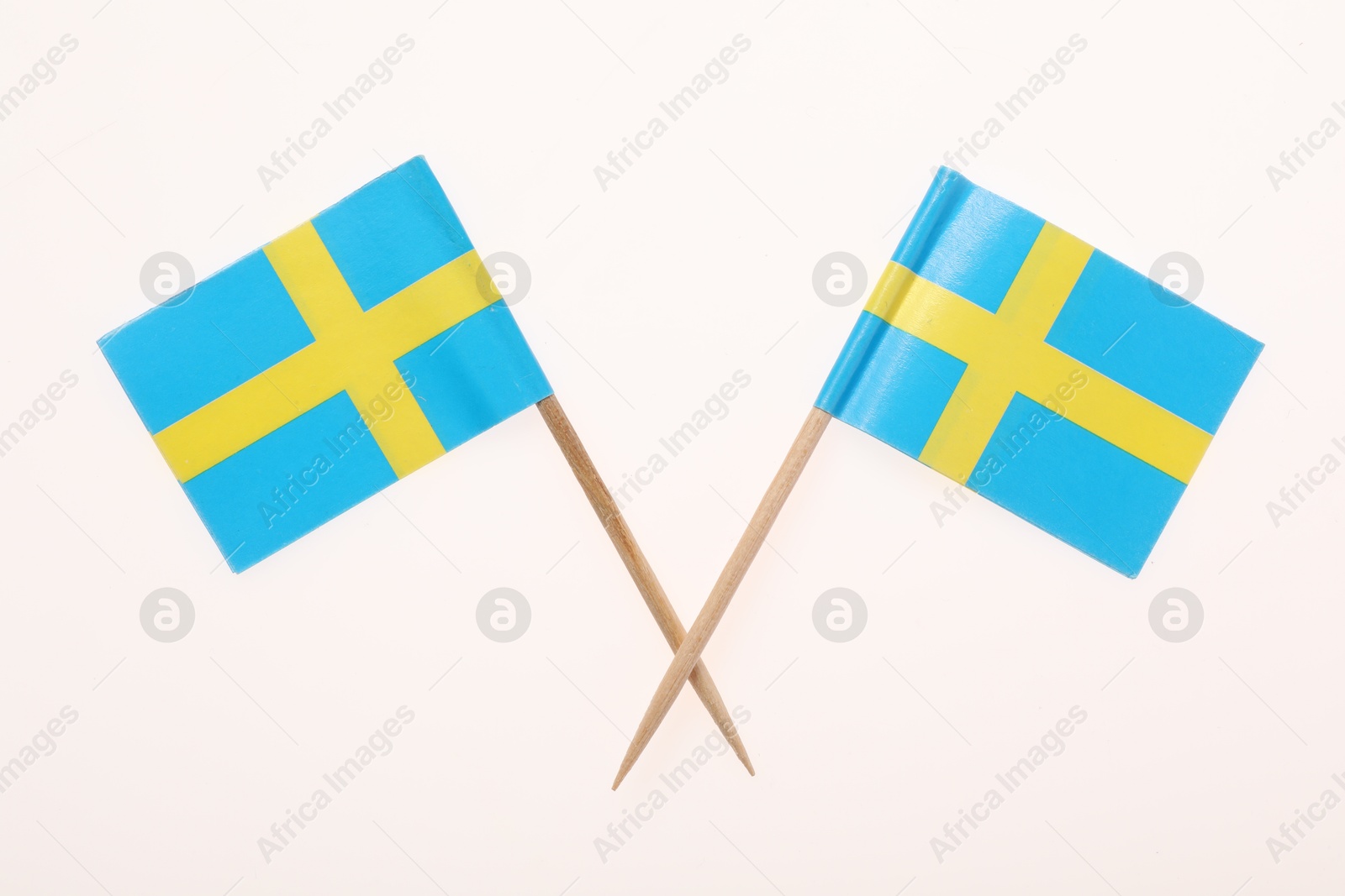 Photo of Small paper flags of Sweden isolated on white