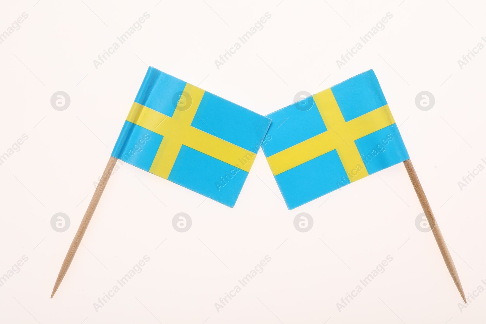 Photo of Small paper flags of Sweden isolated on white