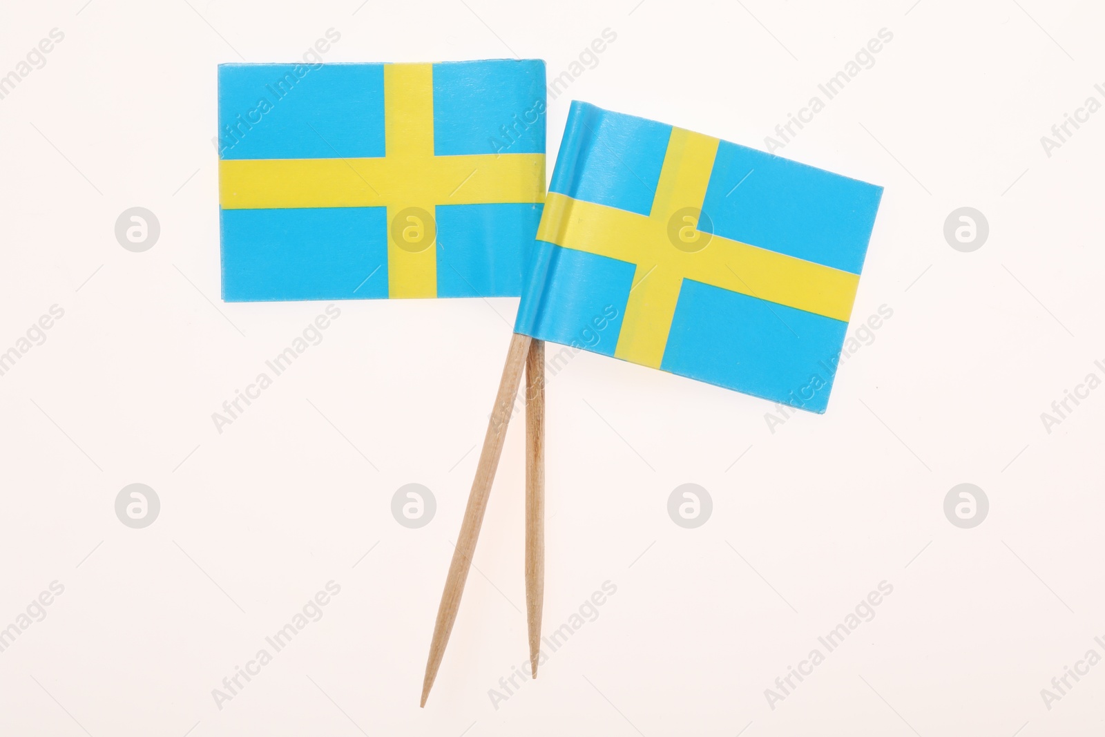 Photo of Small paper flags of Sweden isolated on white