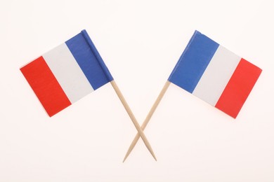 Photo of Small paper flags of France isolated on white