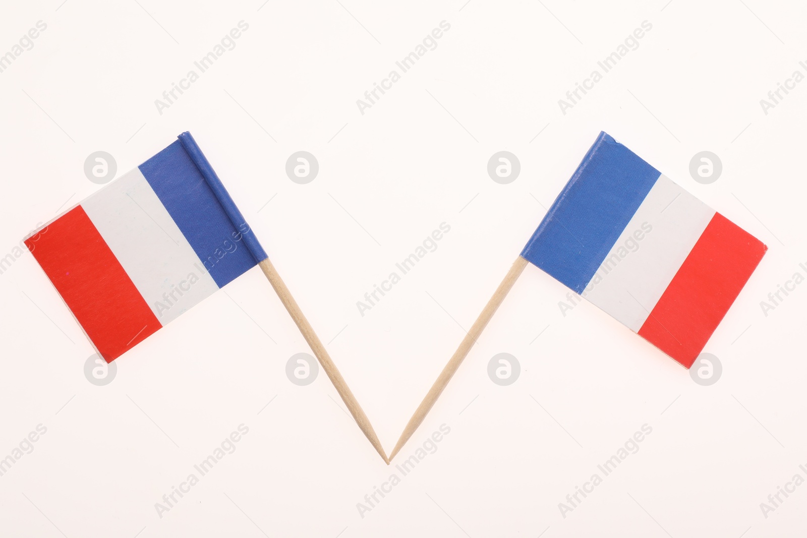 Photo of Small paper flags of France isolated on white