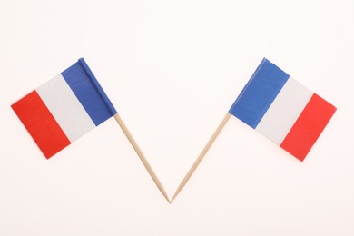 Small paper flags of France isolated on white