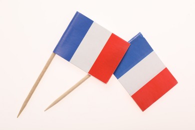 Photo of Small paper flags of France isolated on white