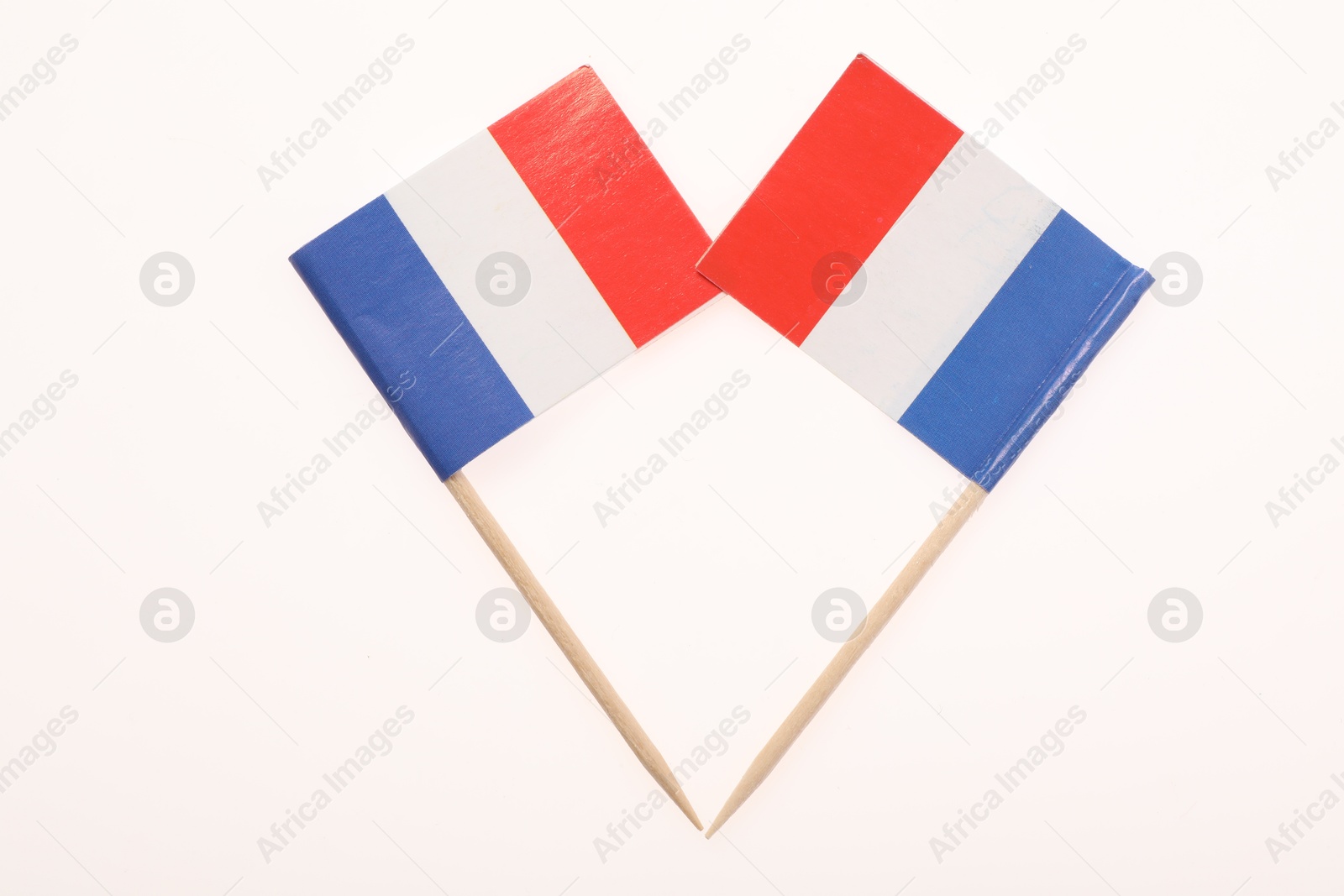 Photo of Small paper flags of France isolated on white