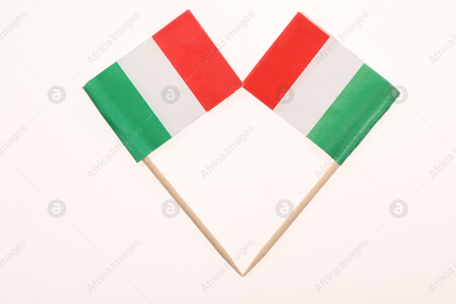 Photo of Small paper flags of Italy isolated on white