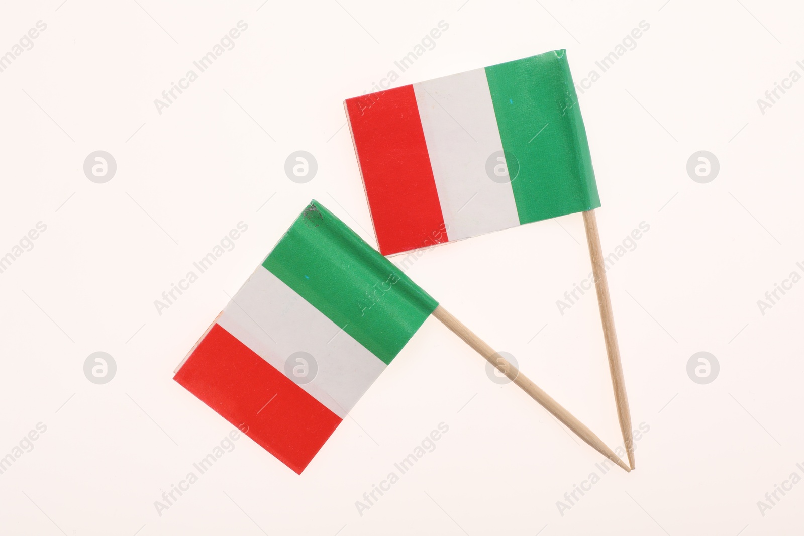 Photo of Small paper flags of Italy isolated on white