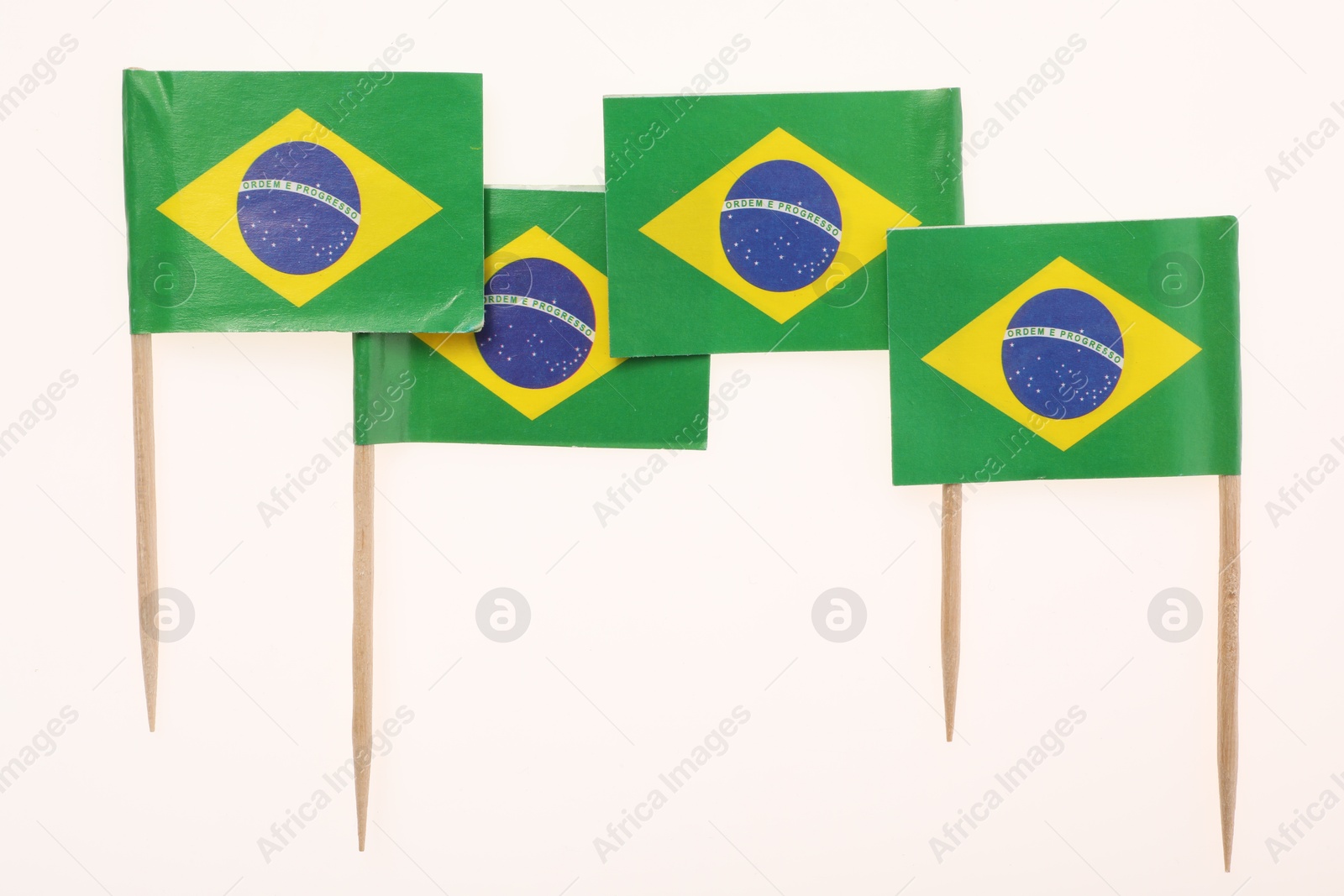 Photo of Small paper flags of Brazil isolated on white