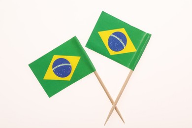 Small paper flags of Brazil isolated on white