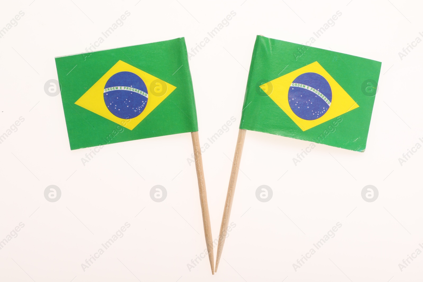 Photo of Small paper flags of Brazil isolated on white