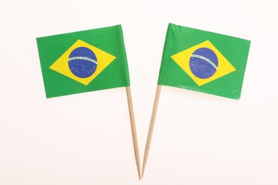 Photo of Small paper flags of Brazil isolated on white