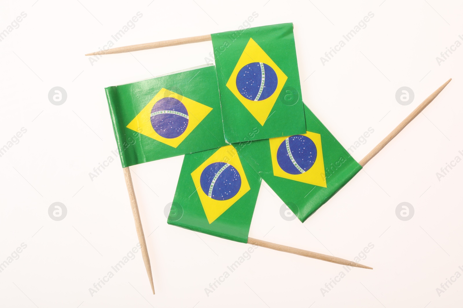 Photo of Small paper flags of Brazil isolated on white