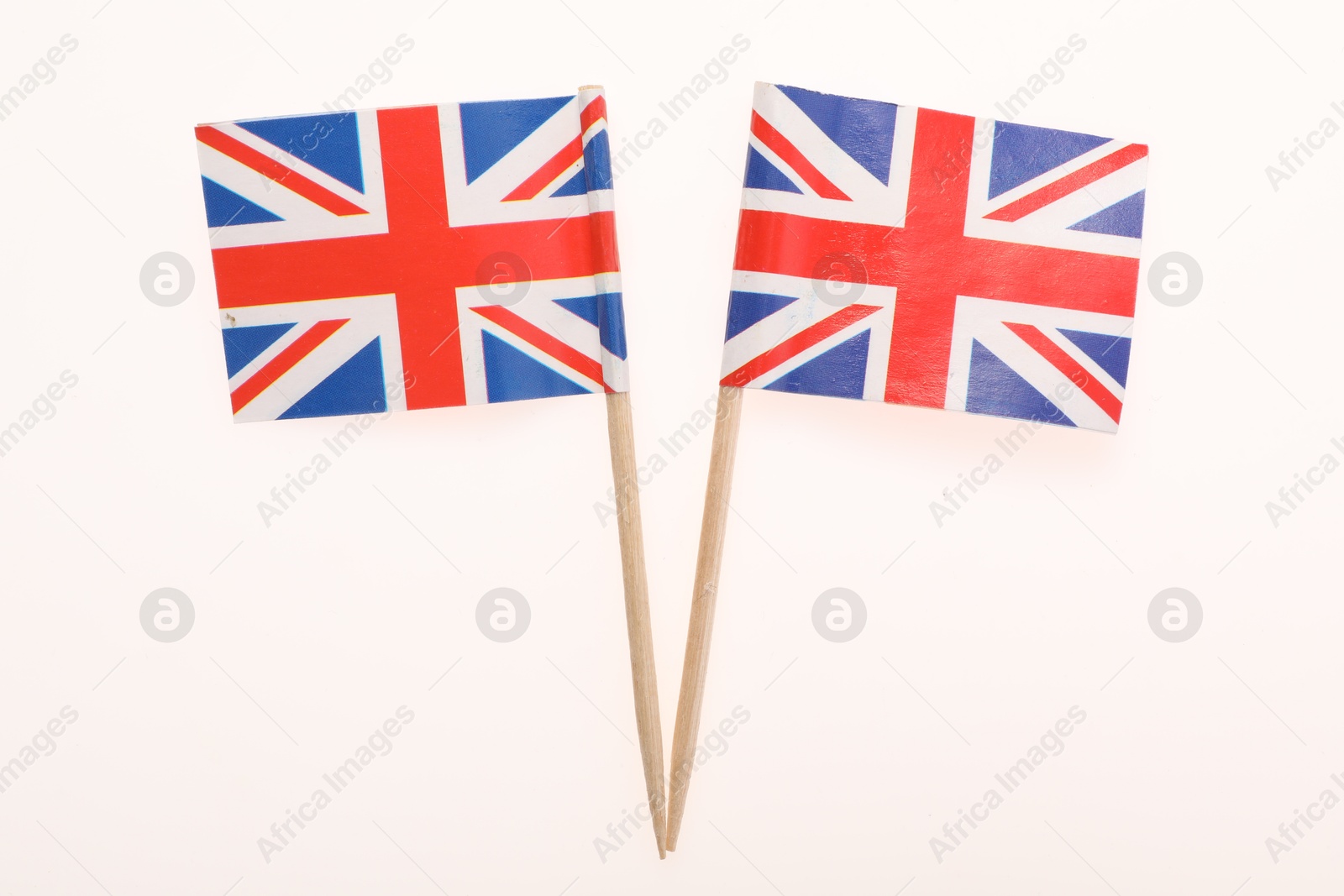 Photo of Small paper flags of United Kingdom isolated on white