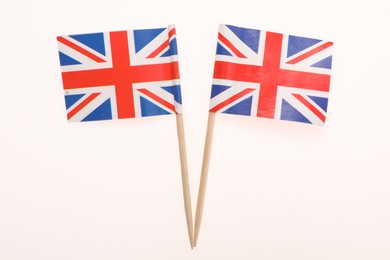 Photo of Small paper flags of United Kingdom isolated on white