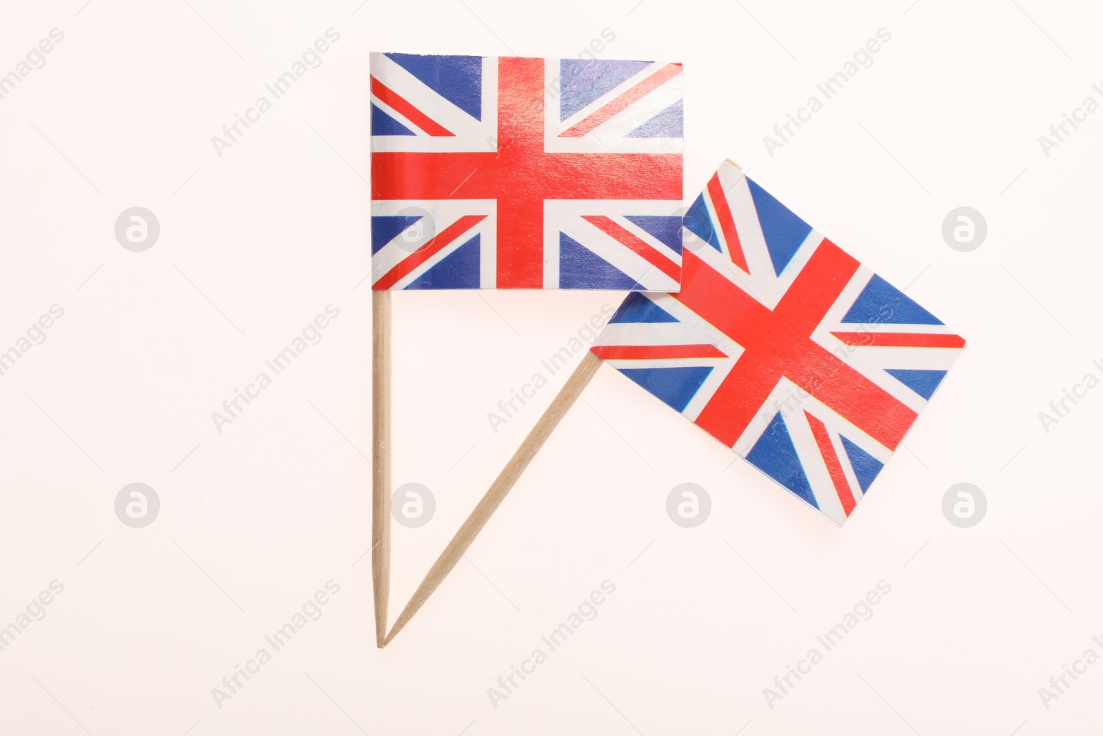 Photo of Small paper flags of United Kingdom isolated on white