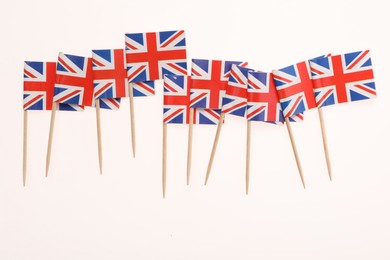 Photo of Small paper flags of United Kingdom isolated on white