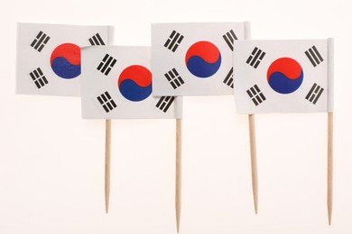 Photo of Small paper flags of South Korea isolated on white