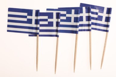 Photo of Small paper flags of Greece isolated on white