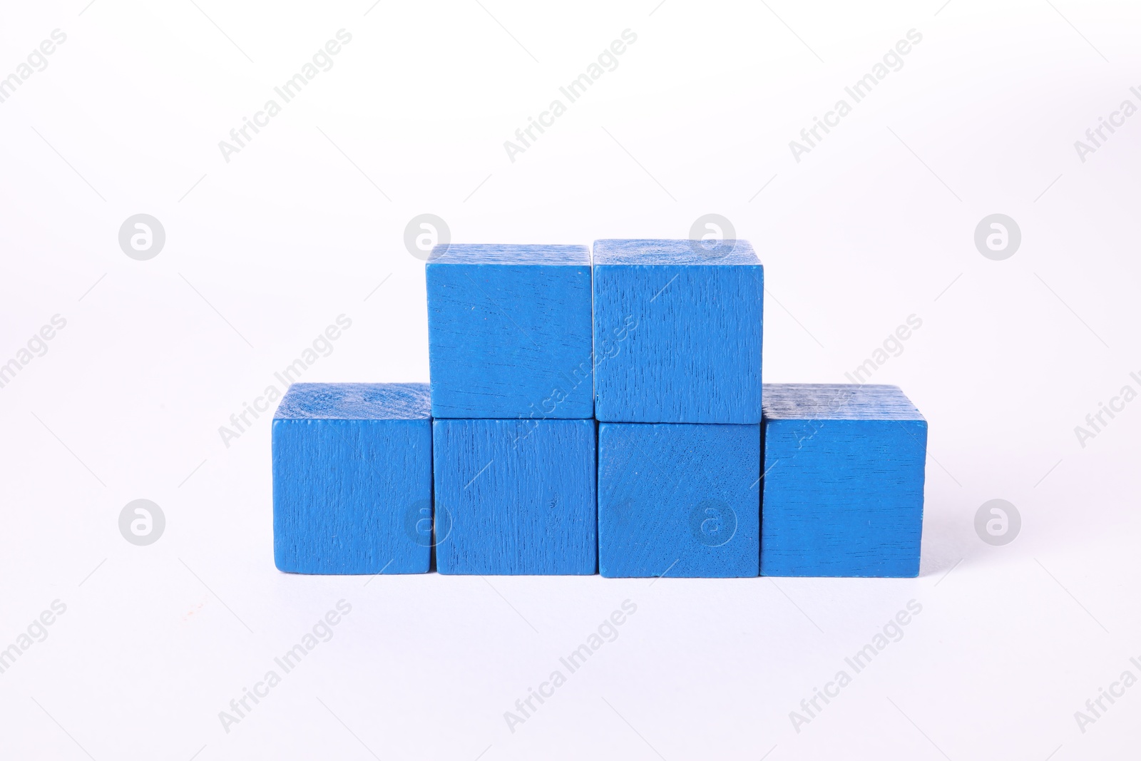 Photo of Many blue wooden cubes isolated on white