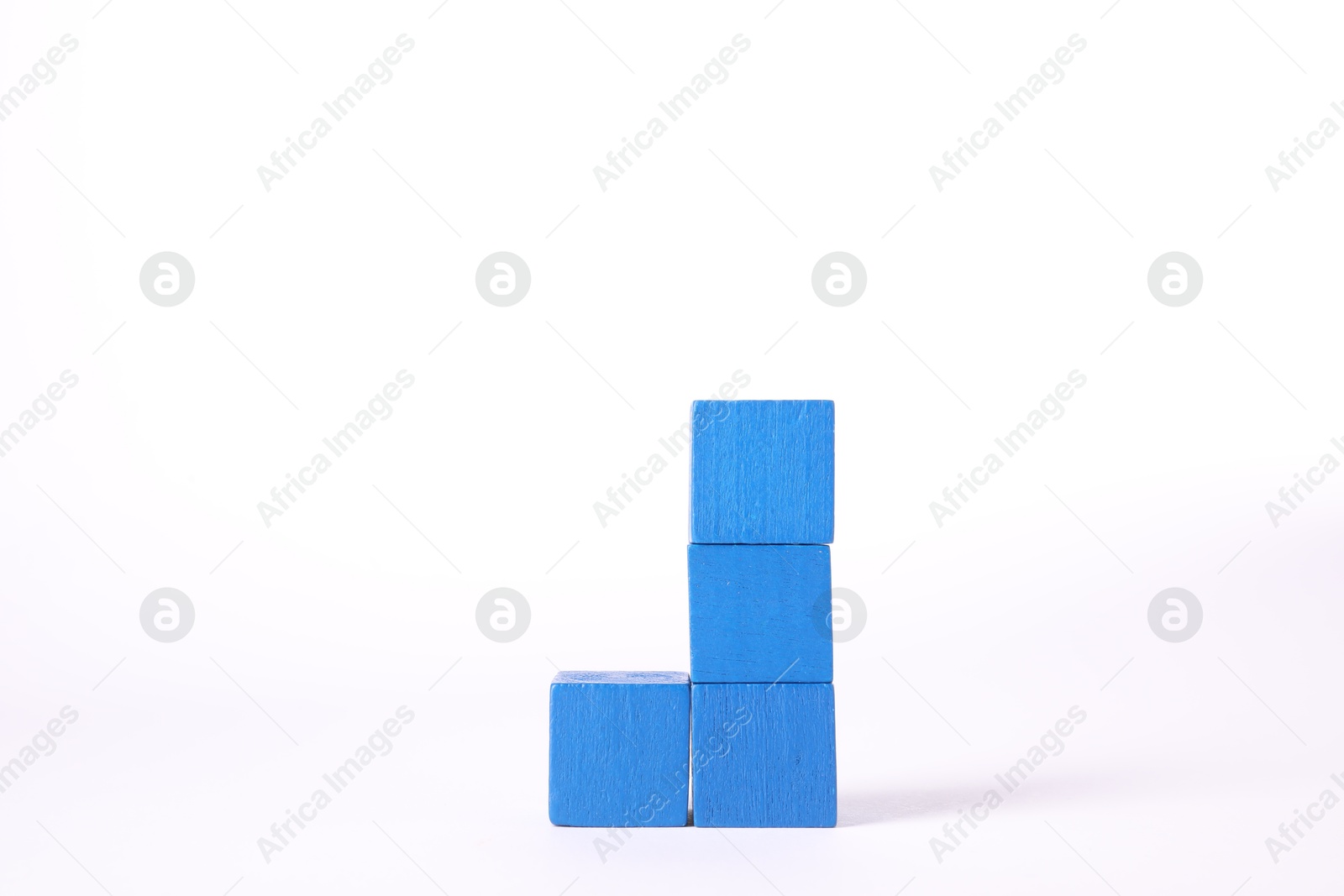 Photo of Many blue wooden cubes isolated on white