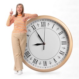 Image of Mature woman and big clock on white background