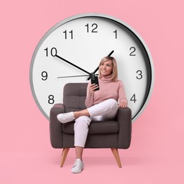 Image of Woman with smartphone sitting in armchair near big clock on pink background