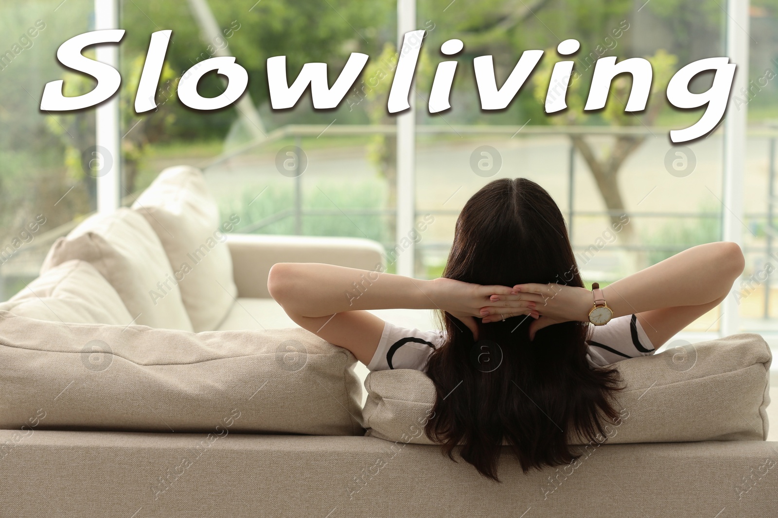 Image of Woman enjoying view outside her window at home. Slow living