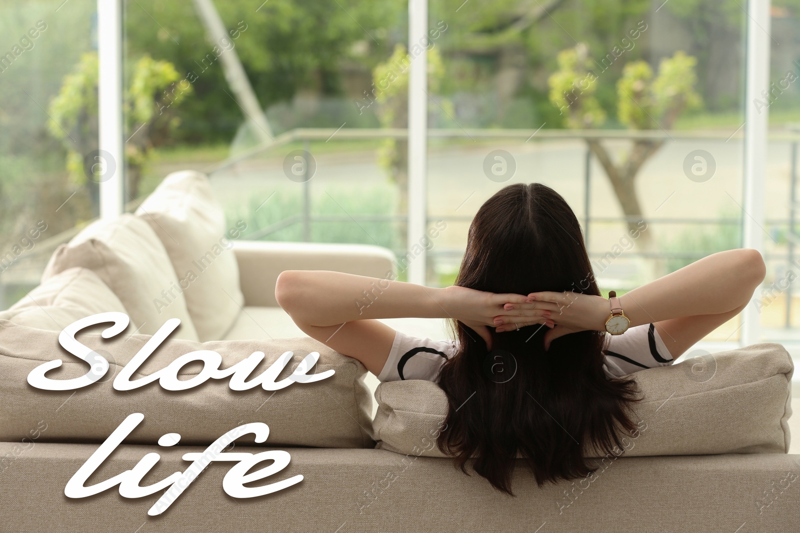 Image of Woman enjoying view outside her window at home. Slow life