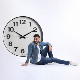 Image of Man and big clock on white background