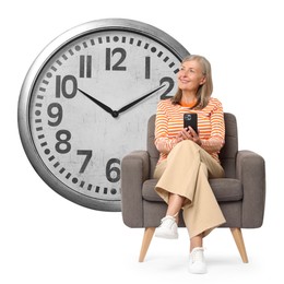 Image of Mature woman with smartphone sitting in armchair near big clock on white background
