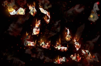 Image of Burning money falling on black background. Financial crisis