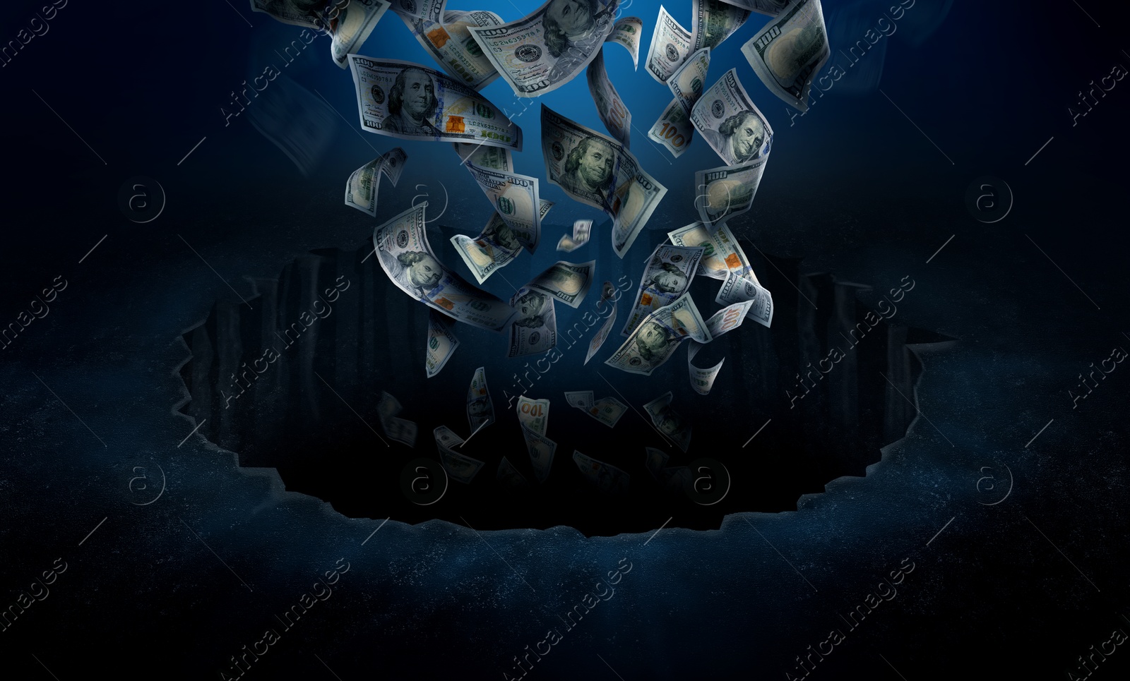 Image of Dollar bills falling into hole. Financial crisis