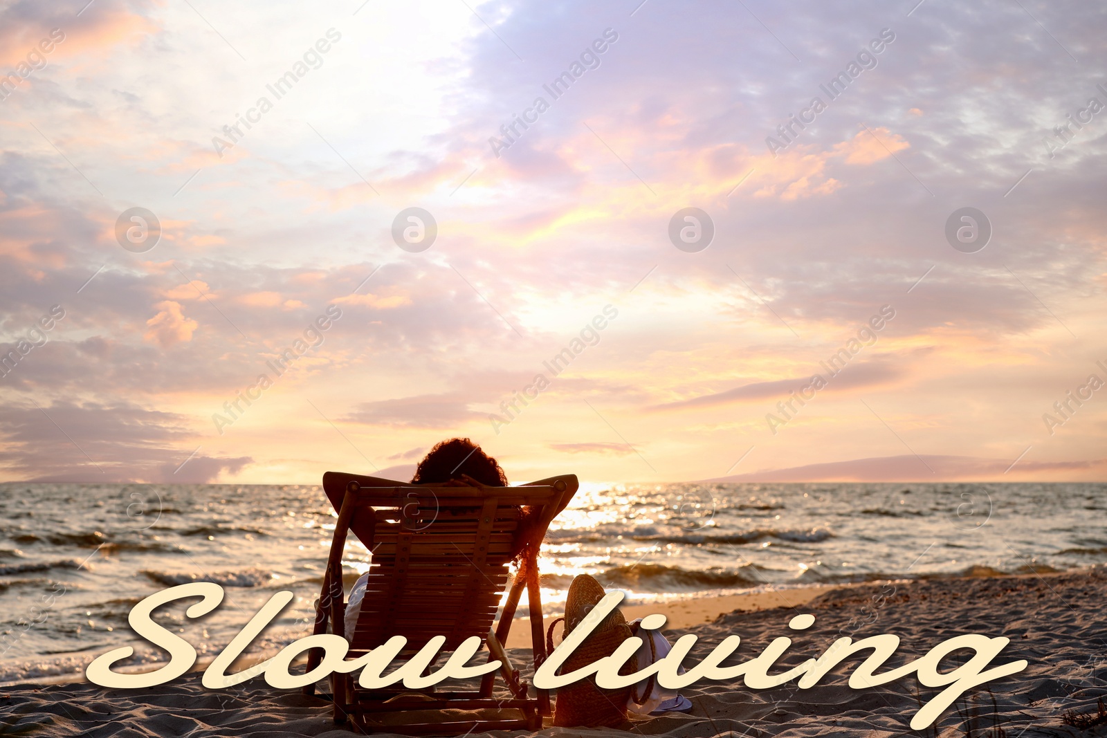 Image of Woman resting by sea at sunset. Slow living